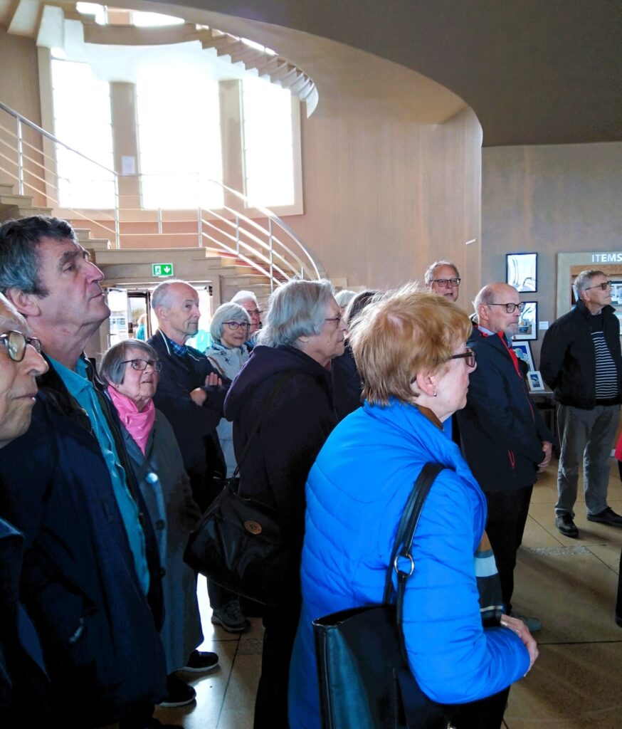A group listening to the guide at the Midland Hotel.