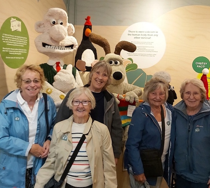 Ladies at the Cheese Factory in Hawes in front of large models of Wallace and Grommit
