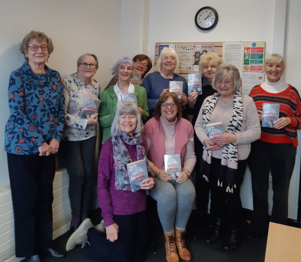 The friendly members of Book Group which meets in Heysham showing one of the books they have read.