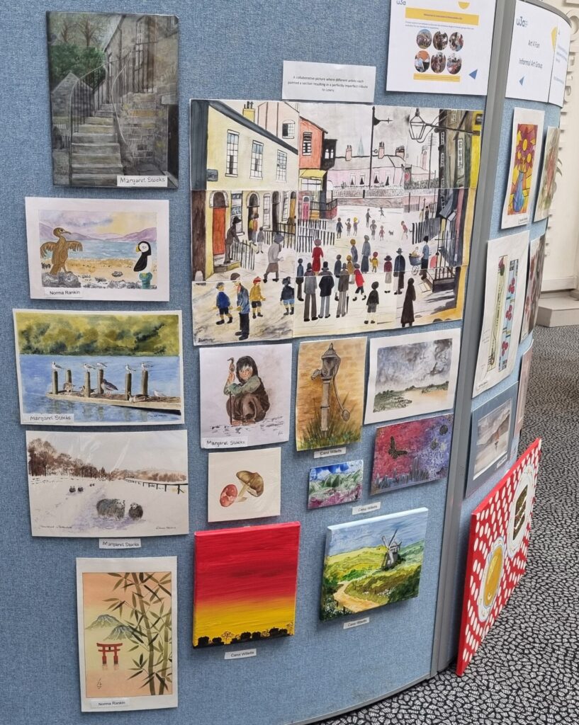 A selection of paintings by the Art4Fun group displayed in the library